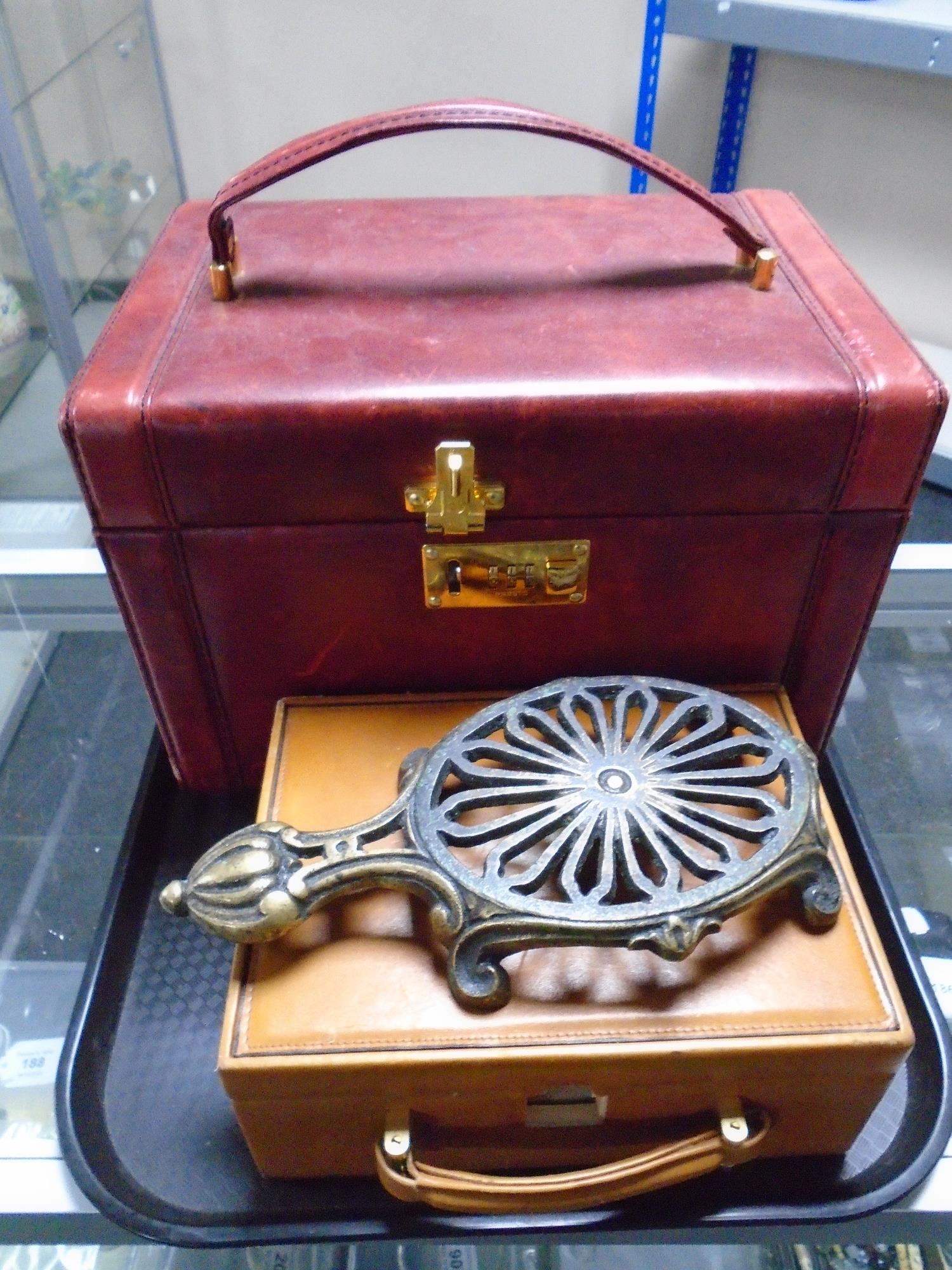 A Presto Burgundy leather vanity case together with a further brown leather trinket box and a brass