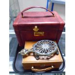 A Presto Burgundy leather vanity case together with a further brown leather trinket box and a brass