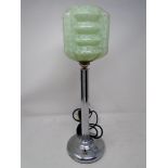 A chrome Art Deco table lamp with green glass shade (height 43cm).