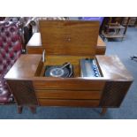 A mid-20th century Bush Solid State stereo system in cabinet, 117cm wide by 43cm deep by 68cm high.