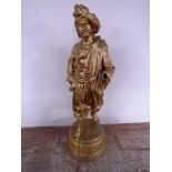 An antique gilded spelter figure of a Persian gentleman with staff on circular base (height 74cm,