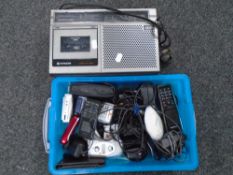 A Hitachi radio cassette player together with a box containing assorted mobile and house phones