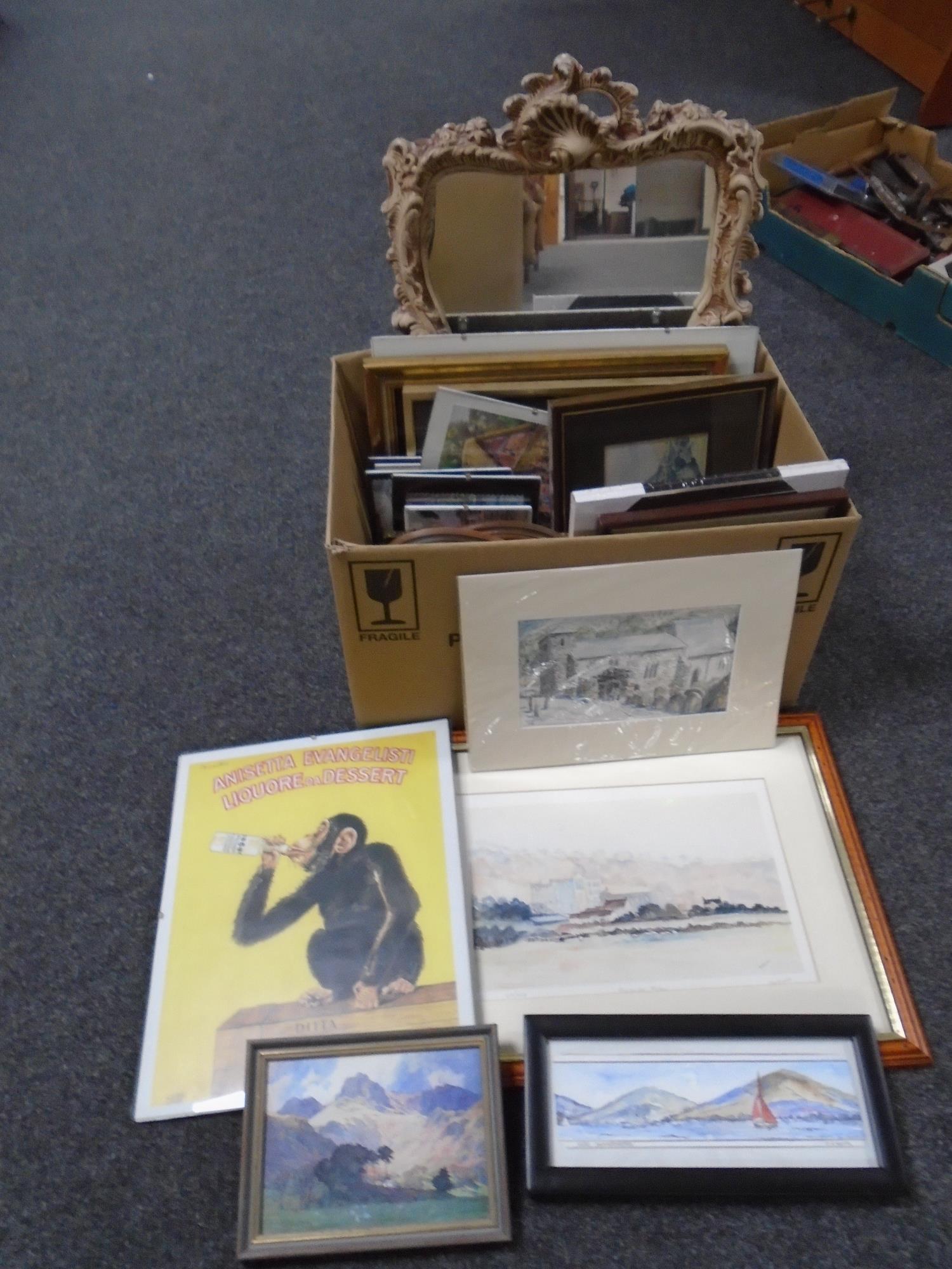 A box containing assorted pictures and prints and a contemporary framed mirror.