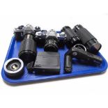 A tray containing Pentax ME Super camera, Canon AV-1 camera,