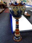 A Royal Doulton Lambethware pottery jardiniere on stand (height 101cm).