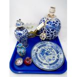 A tray containing oriental wares including blue and white plate,