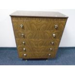 A mid-20th century melamine five drawer chest.