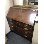 A Georgian mahogany fall front bureau with four drawers