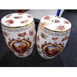 A pair of reproduction porcelain barrel seats (height 46cm).