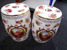 A pair of reproduction porcelain barrel seats (height 46cm).