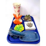 A tray containing Carlton ware trinket box, Poole pottery including a dolphin figure,