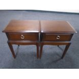 A pair of Stag Minstrel bedside tables fitted with drawers.