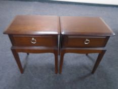 A pair of Stag Minstrel bedside tables fitted with drawers.