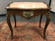 A Louis XV style inlaid walnut, gilt-metal mounted and peach marble-topped centre table,