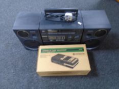 A Panasonic S-XBS music system together with a boxed Hitachi cassette tape record.