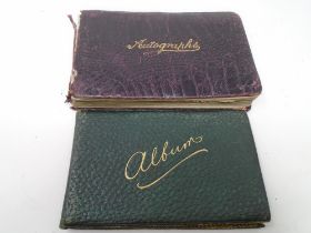 Two early 20th century autograph albums containing hand coloured drawings, watercolours, notations,