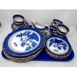 A tray of 26 pieces of Boothes Real Old Willow pattern dinnerware.