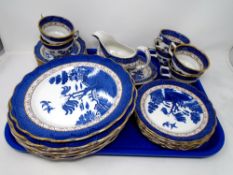 A tray of 26 pieces of Boothes Real Old Willow pattern dinnerware.