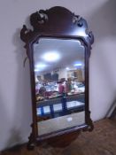 A Victorian Chippendale style wall mirror.