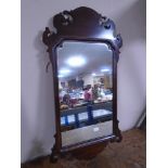 A Victorian Chippendale style wall mirror.