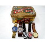 A Yorkshire tea tin containing five assorted gents wristwatches including Sekonda, Diesel etc.
