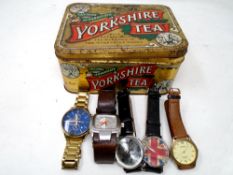 A Yorkshire tea tin containing five assorted gents wristwatches including Sekonda, Diesel etc.