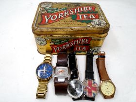 A Yorkshire tea tin containing five assorted gents wristwatches including Sekonda, Diesel etc.
