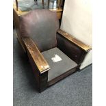 A 1930's oak framed fireside armchair.