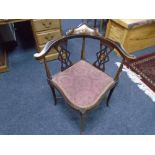 An inlaid mahogany corner armchair.