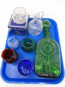 A tray containing large green glass decanter with stopper, other glassware including Caithness vase,