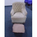A bedroom chair upholstered in button dralon together with a footstool.