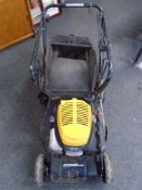 A JCB Combi 46s petrol self drive lawn mower with grass box.