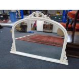 A contemporary arch topped overmantel mirror,