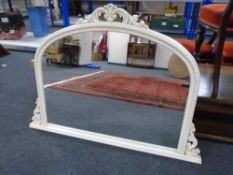 A contemporary arch topped overmantel mirror,