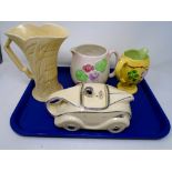 A tray containing a novelty teapot in the form of a racing car, Arthur Wood vase,