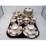 A collection of 39 pieces of antique floral patterned tea china.