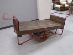 A metal framed and wooden porter's trolley.