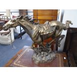 A gilt resin figure of a galloping horse.