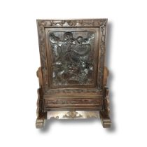 A Chinese hardwood table screen with carved dragon decoration, height 63 cm, width 46 cm.