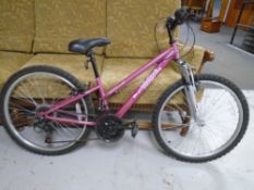 A girl's Apollo Vivid front suspension mountain bike.