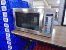 A Daewoo stainless steel catering microwave.