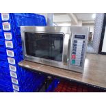 A Daewoo stainless steel catering microwave.