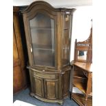 An Italian style glaze door display cabinet with cupboard fitted beneath,