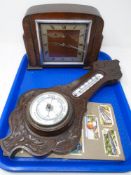 A tray containing aneroid barometer,