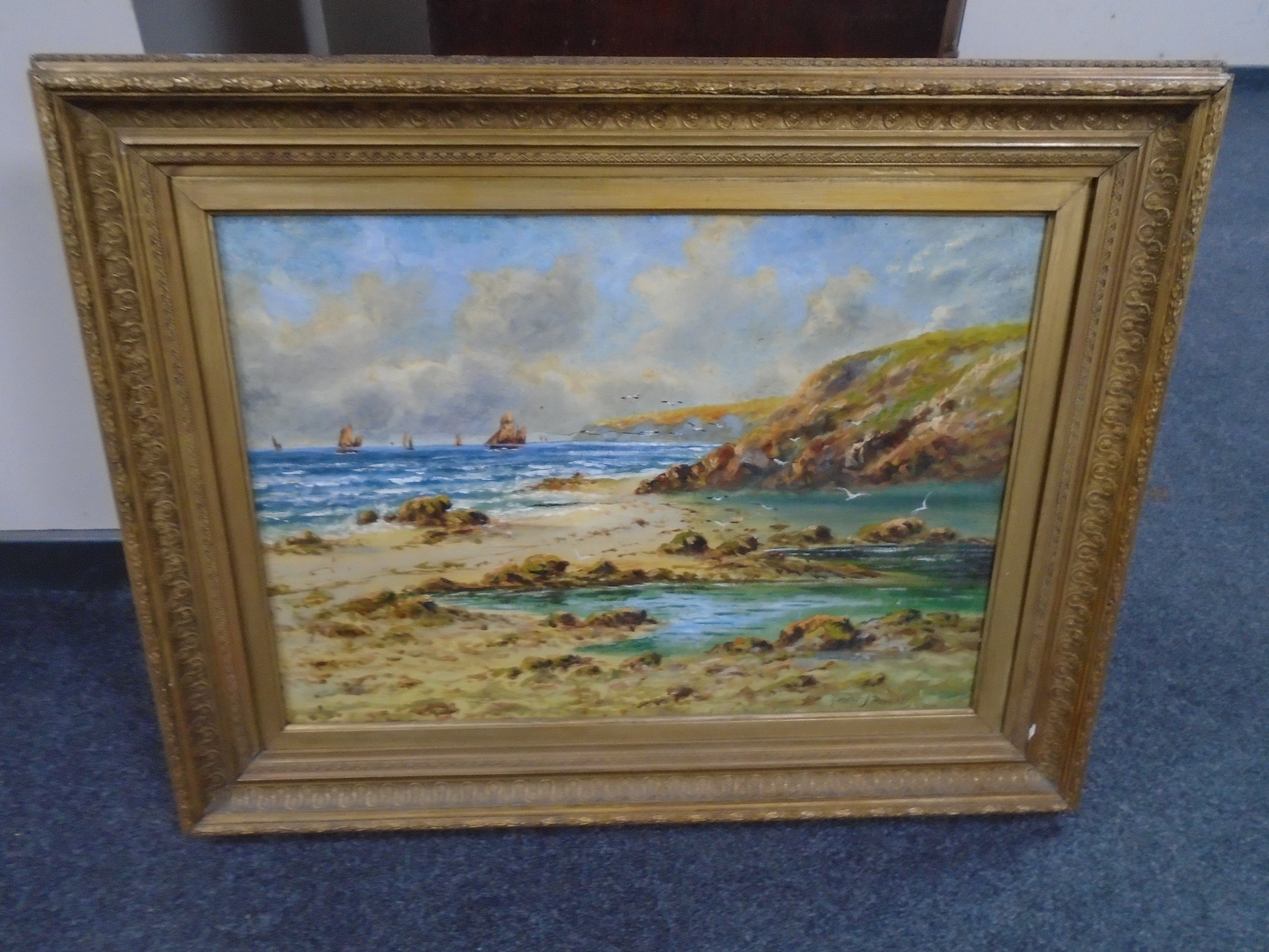 Robert J Pollard II : Boats of a rocky coastline, oil-on-canvas, in gilt frame.