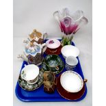 A tray containing two Saddler commemorative teapots, coloured glass flower vase,