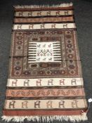 A Caucasian rug of zoomorphic design,