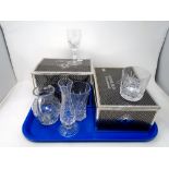 A tray containing two sets of Edinburgh International crystal tumblers and wine glasses together