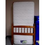 A 3' pine bed with Silent Night Miracoil 7 Memory Breathe mattress.