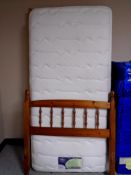 A 3' pine bed with Silent Night Miracoil 7 Memory Breathe mattress.